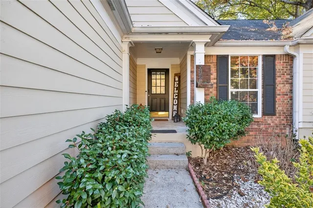 a view of a house with a flower garden