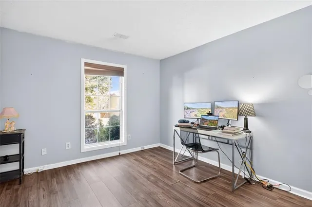 a workspace with furniture and wooden floor