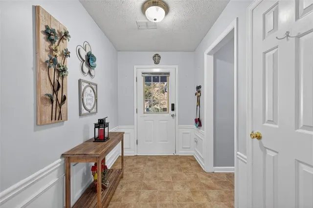 a view of an entryway with wooden floor