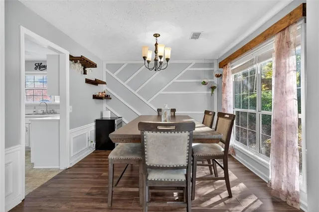 a view of a dining room with furniture window and outside view