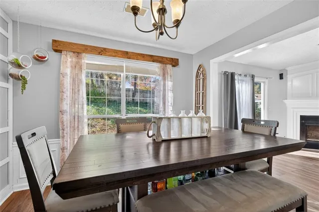 a view of a dining room with furniture window and wooden floor