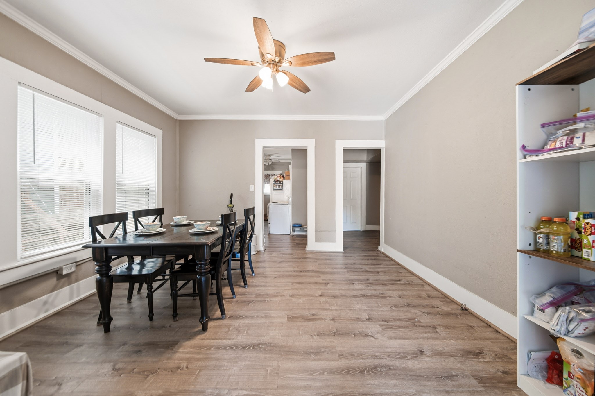 1302 20th Street Huntsville, TX 77340 - Photo 19 of 26 a view of a dining room with furniture and a window