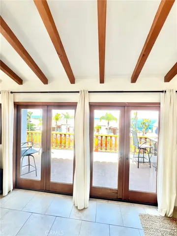 a view of an entryway with a floor to ceiling window