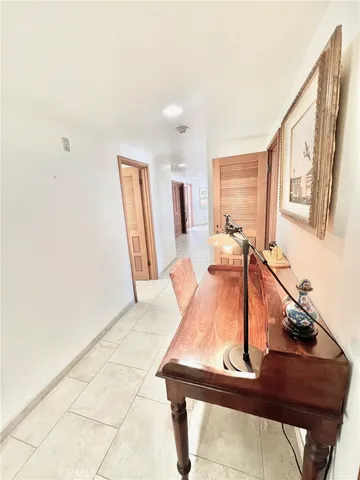 a view of a livingroom with wooden floor and a window