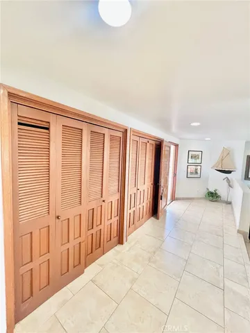 a large kitchen with kitchen island a sink and a stove top oven