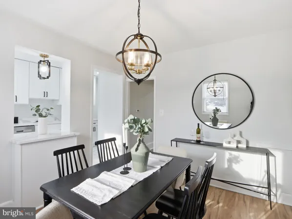 a view of a livingroom with furniture and mirror