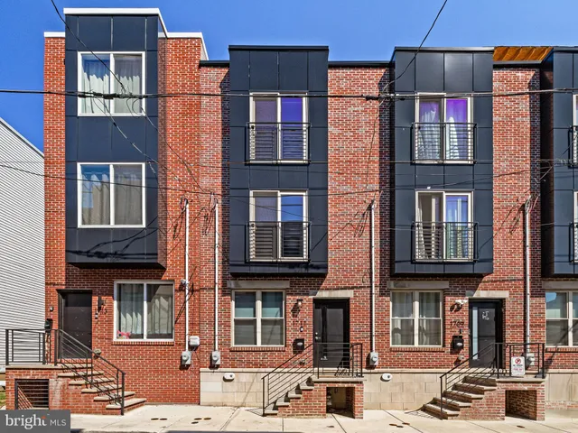 a view of a building with a window and brick walls
