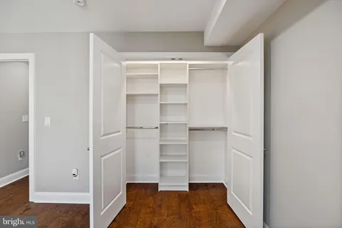 a view of a hallway with washer and dryer