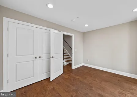 a view of front door with wooden floor