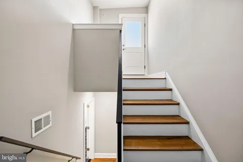 a bathroom with a shower toilet and sink