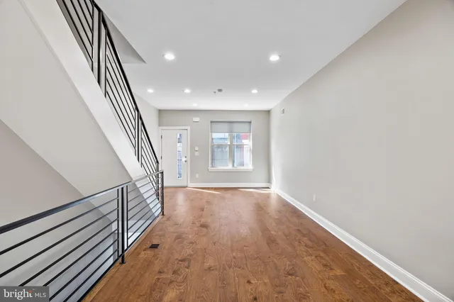 a view of kitchen with furniture and refrigerator