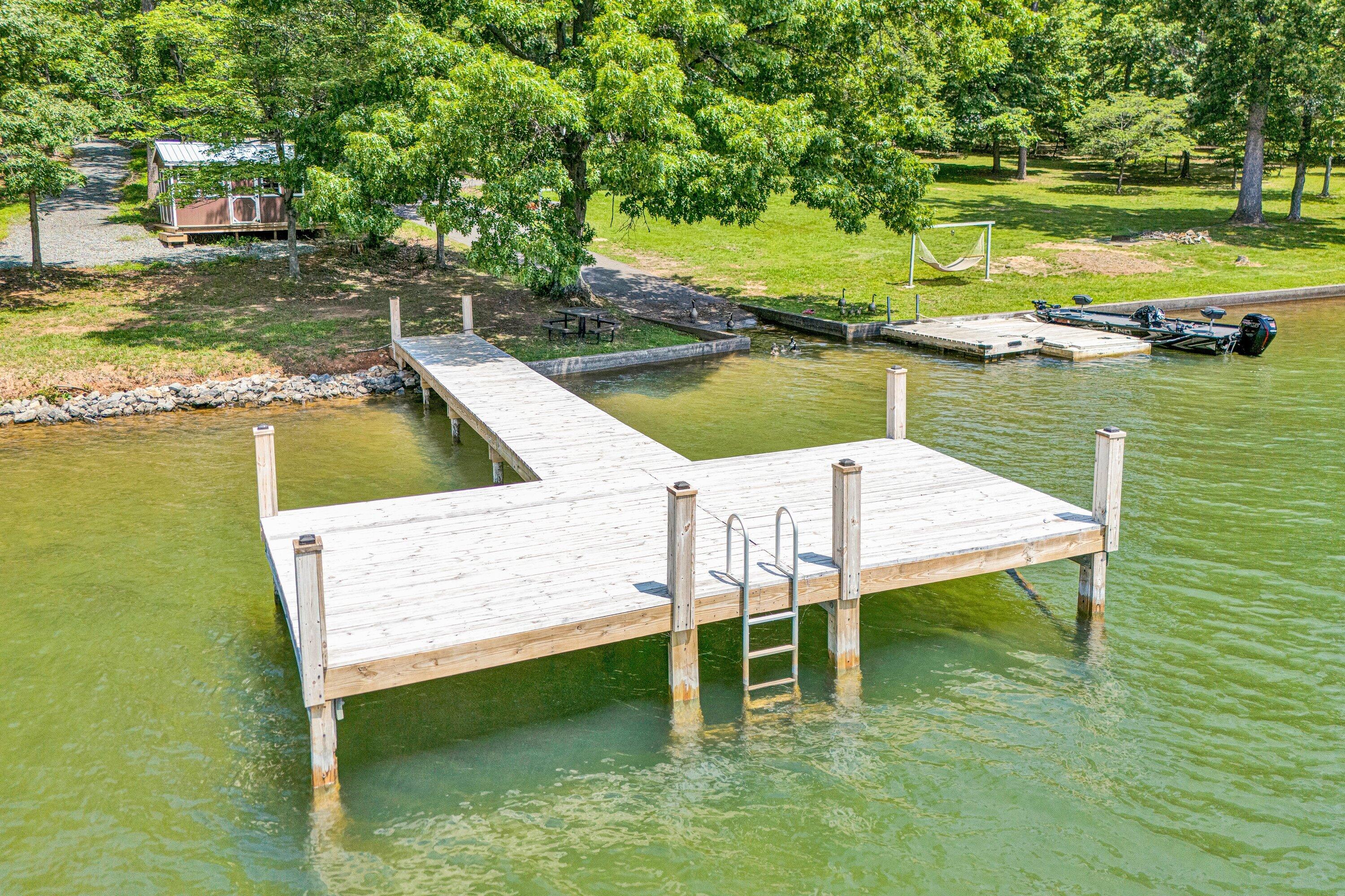 Lot 3 Sigh N Pine Road Huddleston, VA 24104 - Photo 7 of 23 a view of a lake with table and chairs