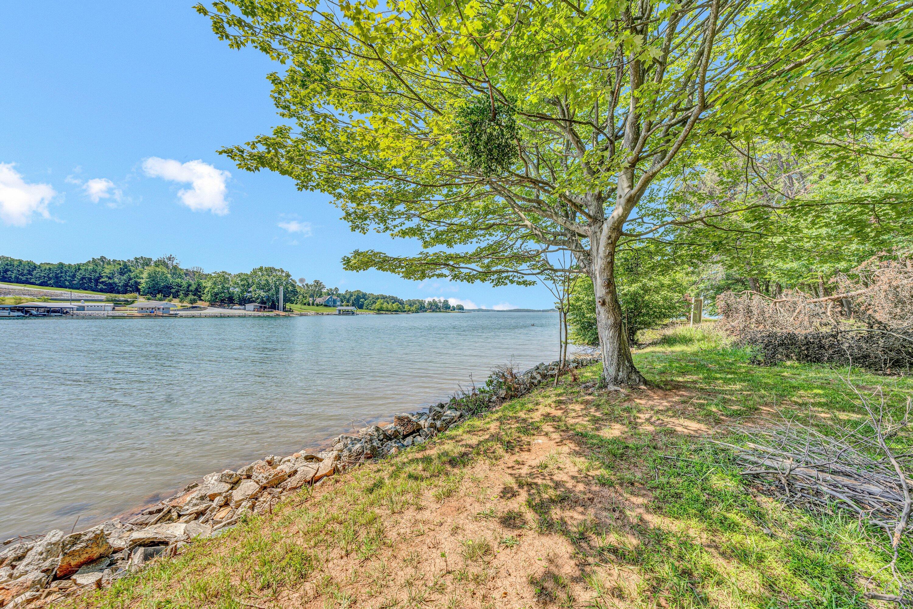 Lot 3 Sigh N Pine Road Huddleston, VA 24104 - Photo 10 of 23 a view of a lake with a house in the background