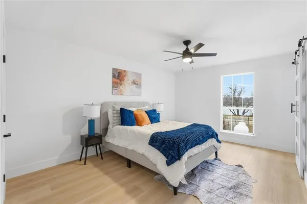 a bedroom with a bed and a table in it