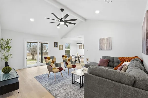 a living room with furniture and a window