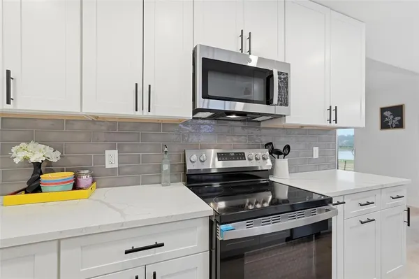 a kitchen with a stove and a microwave