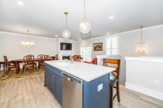 a large kitchen with a table and chairs