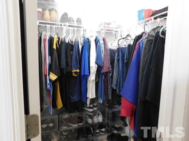 924 Roxy Street Raleigh, NC 27610 - Photo 14 of 15 a view of walk in closet with clothes