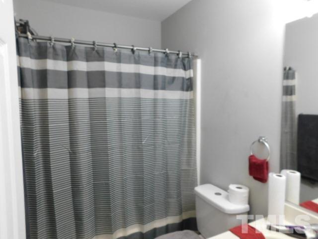 924 Roxy Street Raleigh, NC 27610 - Photo 15 of 15 a bathroom with a sink and toilet