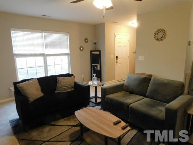 924 Roxy Street Raleigh, NC 27610 - Photo 4 of 15 a living room with furniture and a window