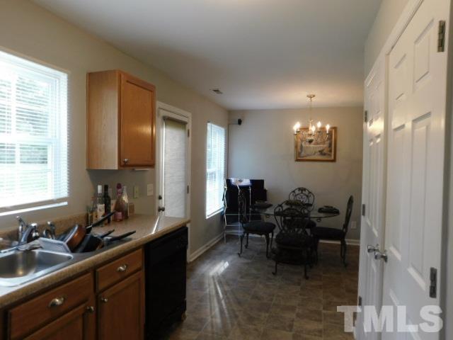 924 Roxy Street Raleigh, NC 27610 - Photo 9 of 15 a spacious bathroom with double vanity and a mirror