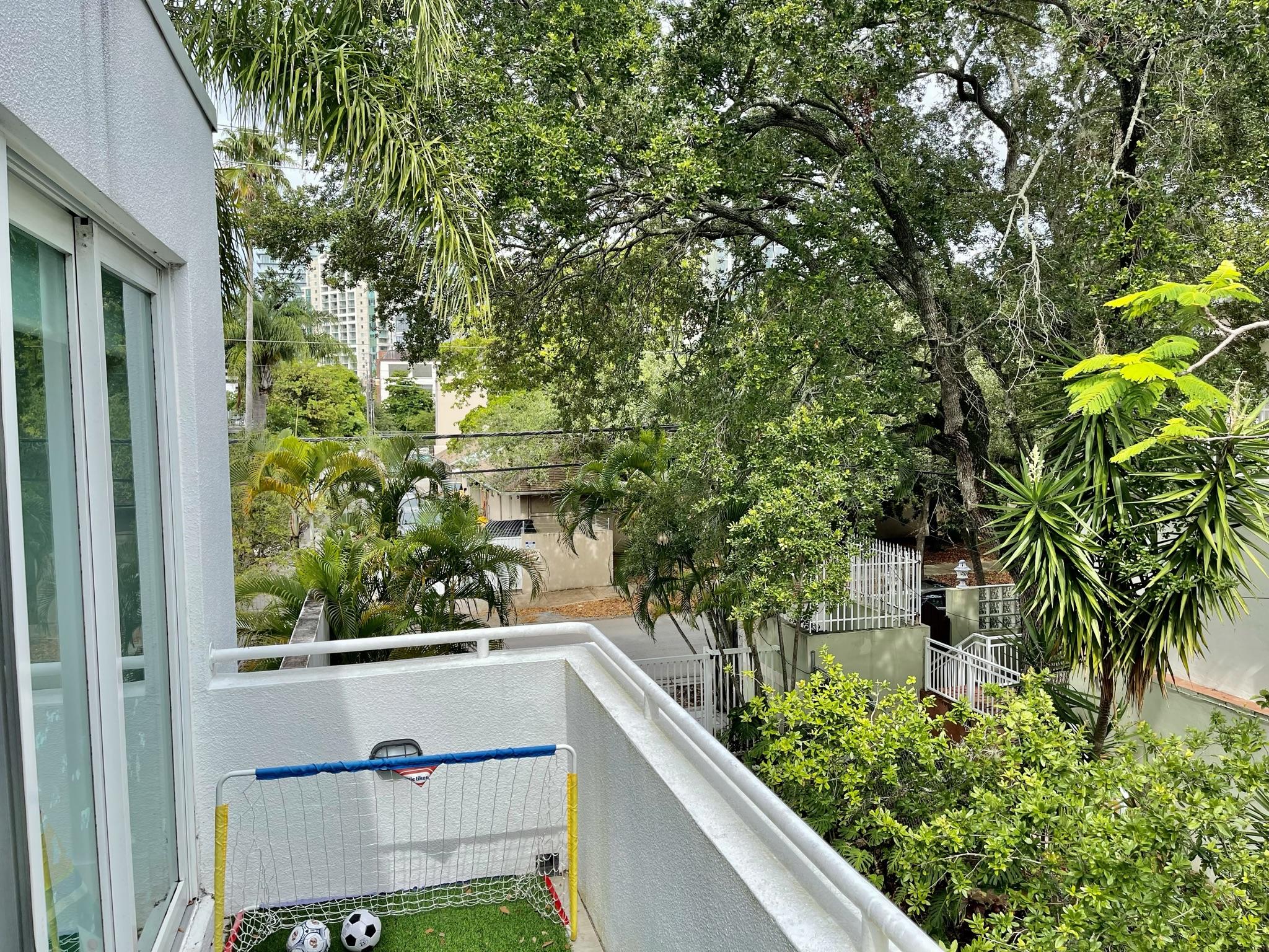 3258 Virginia Street, Unit A4 Miami, FL 33133 - Photo 18 of 20 a view of balcony with plants