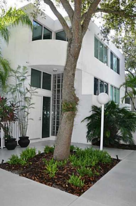 3258 Virginia Street, Unit A4 Miami, FL 33133 - Photo 2 of 20 a front view of a house with garden