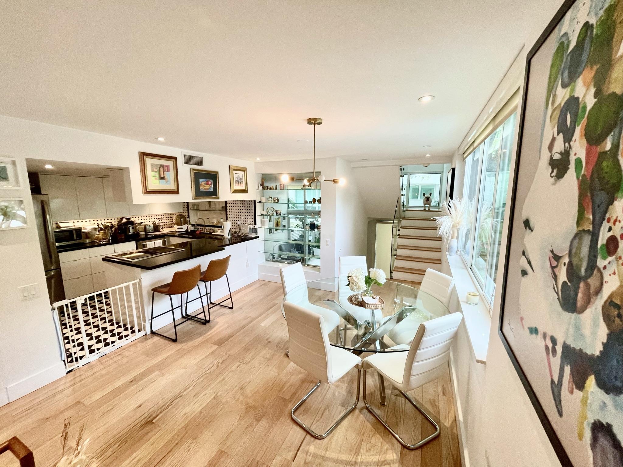 3258 Virginia Street, Unit A4 Miami, FL 33133 - Photo 9 of 20 a dining room with furniture and wooden floor