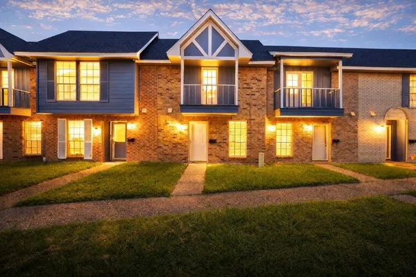 a front view of a house having yard