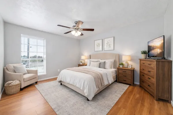 a bedroom with a large bed and furniture