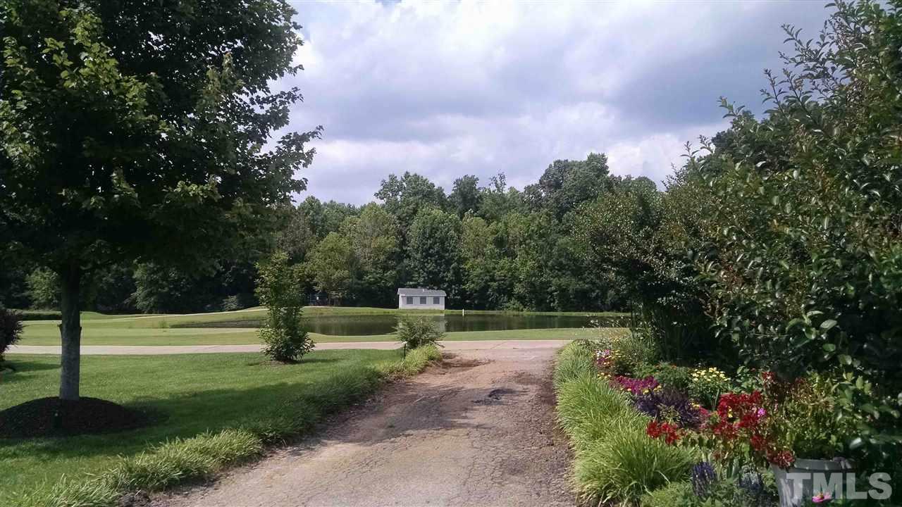 850 Seastone Street Raleigh, NC 27603 - Photo 22 of 25 a green field with lots of flowers in it