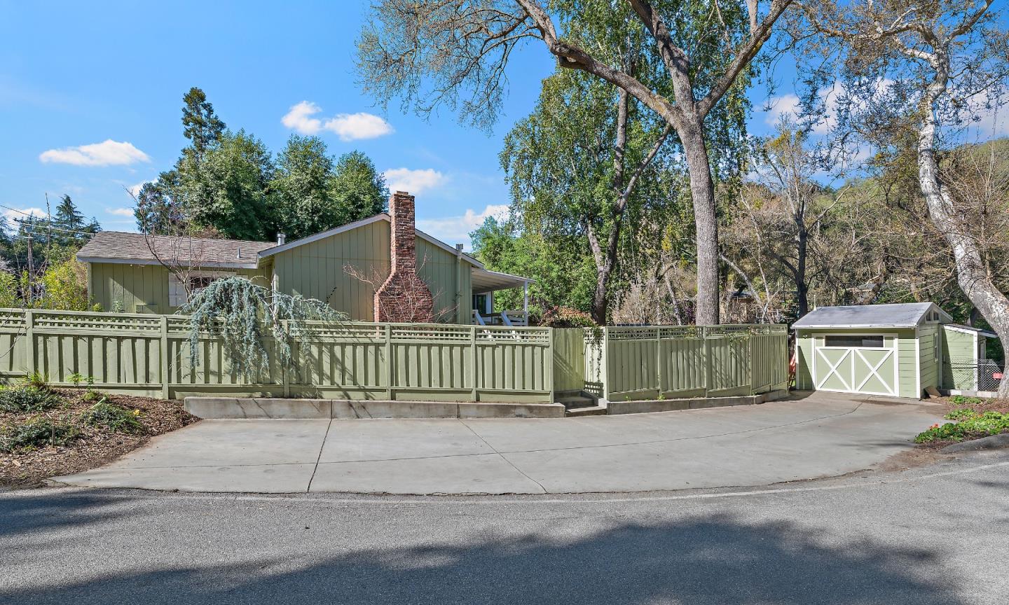 21195 Bertram Road San Jose, CA 95120 - Photo 12 of 20 a view of a house with a small yard and fence