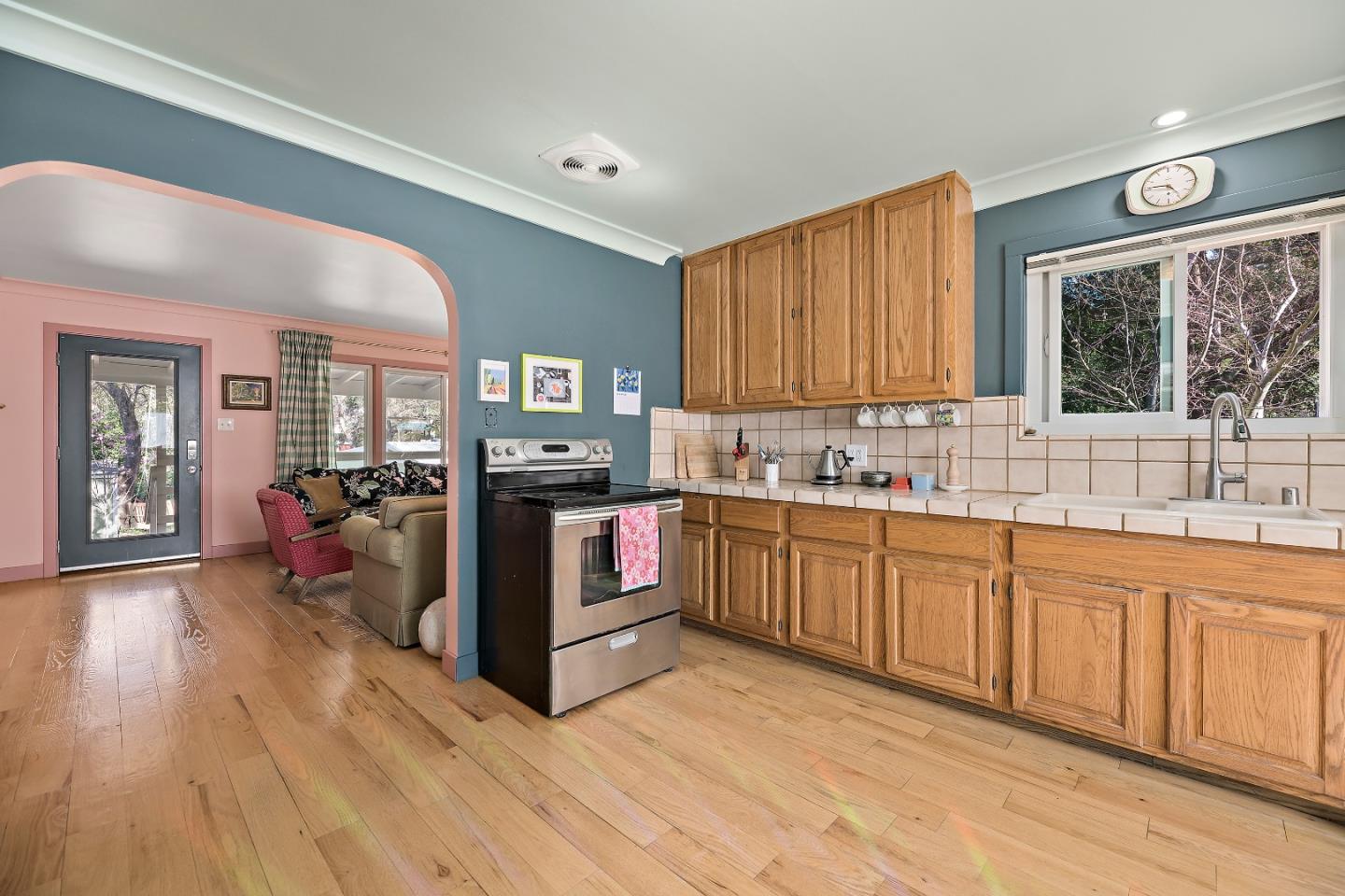 21195 Bertram Road San Jose, CA 95120 - Photo 6 of 20 a kitchen with stainless steel appliances granite countertop a stove sink and cabinets