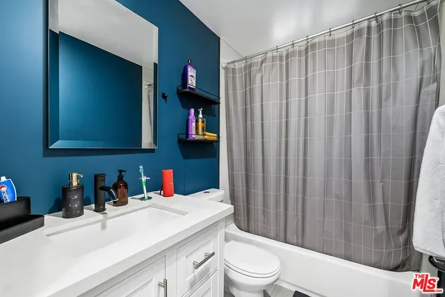 a bathroom with a sink a toilet and a bathtub