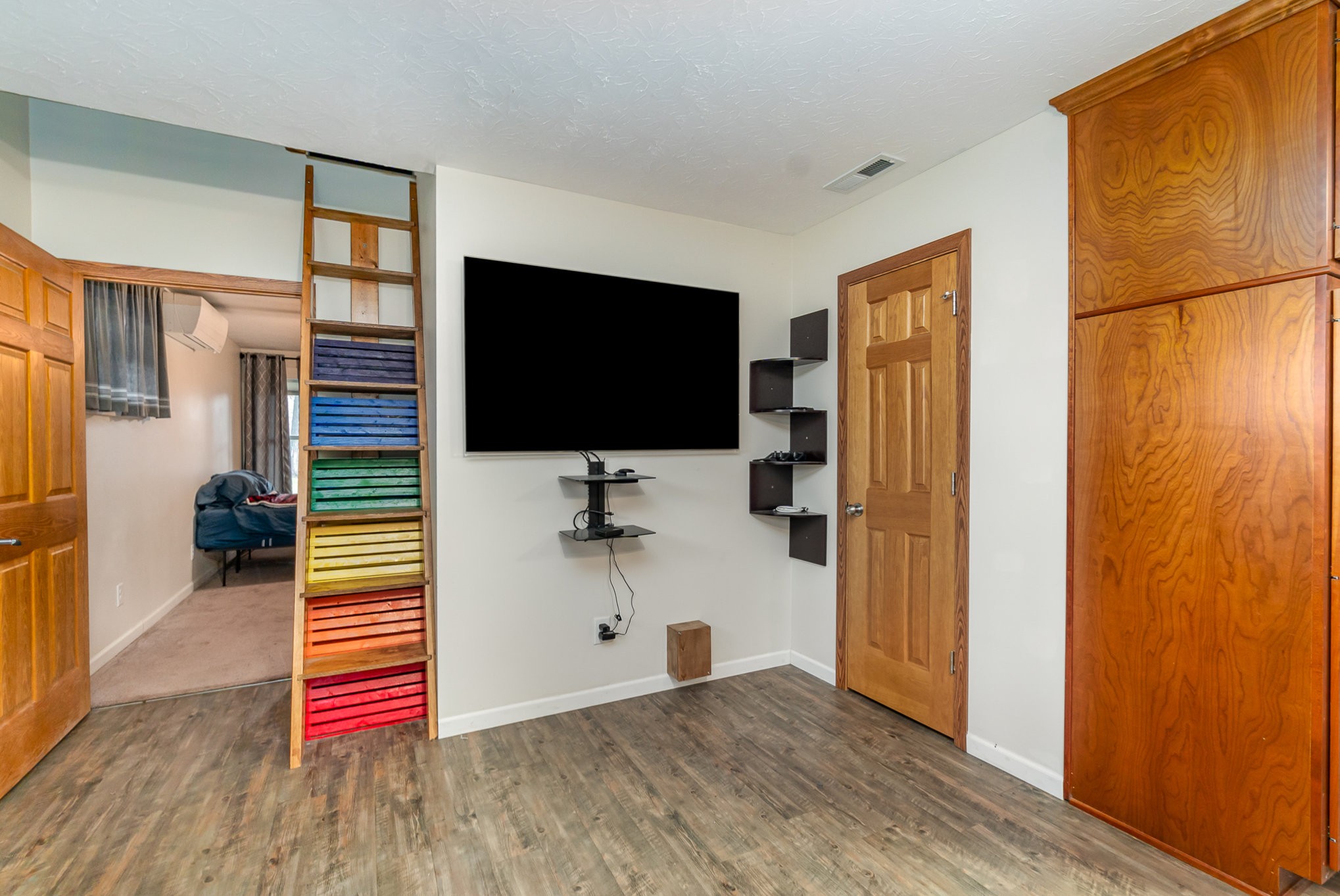 6960 Highway 231 Bethpage, TN 37022 - Photo 14 of 32 a bedroom with a bed and a flat screen tv