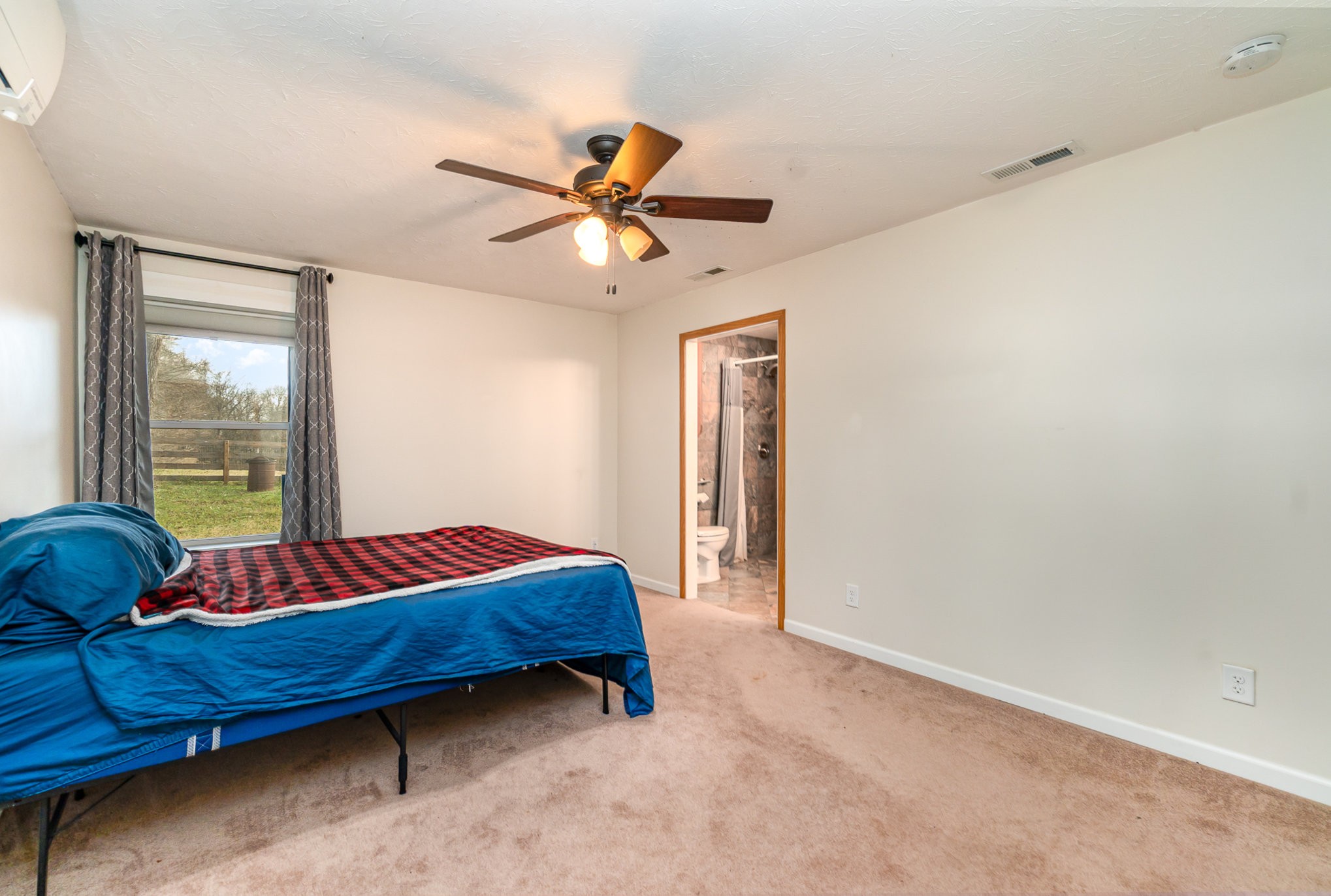 6960 Highway 231 Bethpage, TN 37022 - Photo 15 of 32 a bedroom with a bed and window