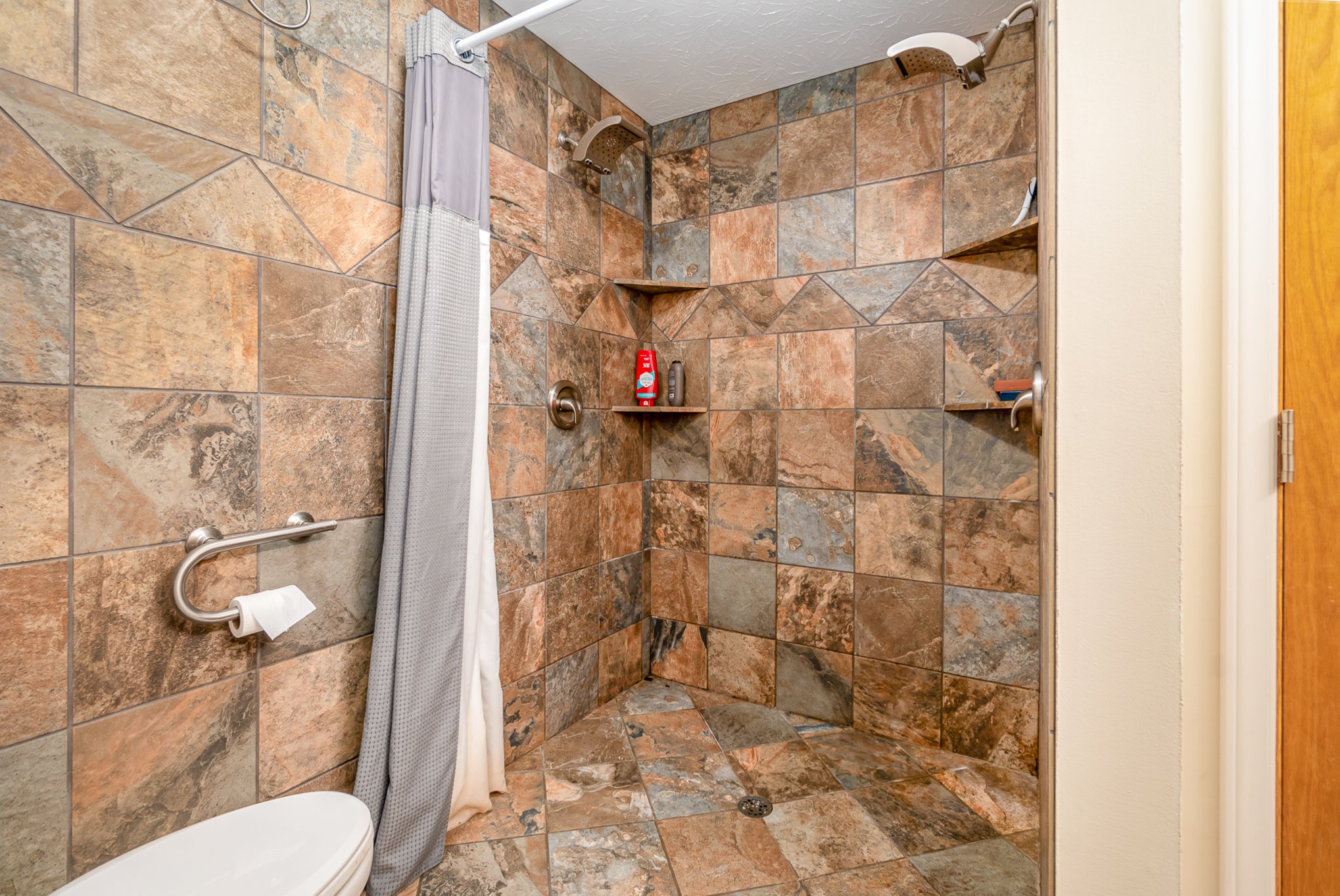 6960 Highway 231 Bethpage, TN 37022 - Photo 19 of 32 a bathroom with a toilet and shower