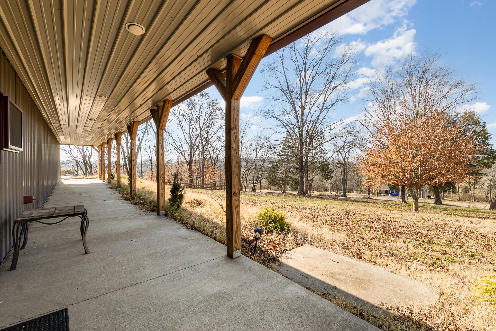 6960 Highway 231 Bethpage, TN 37022 - Photo 2 of 32 a view of a yard with wooden fence and trees