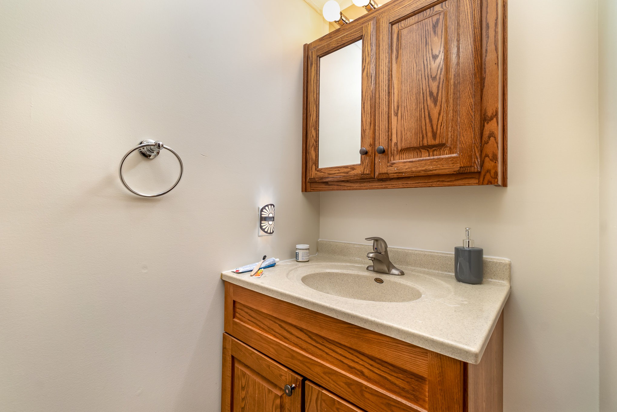 6960 Highway 231 Bethpage, TN 37022 - Photo 23 of 32 a bathroom with a sink and a mirror