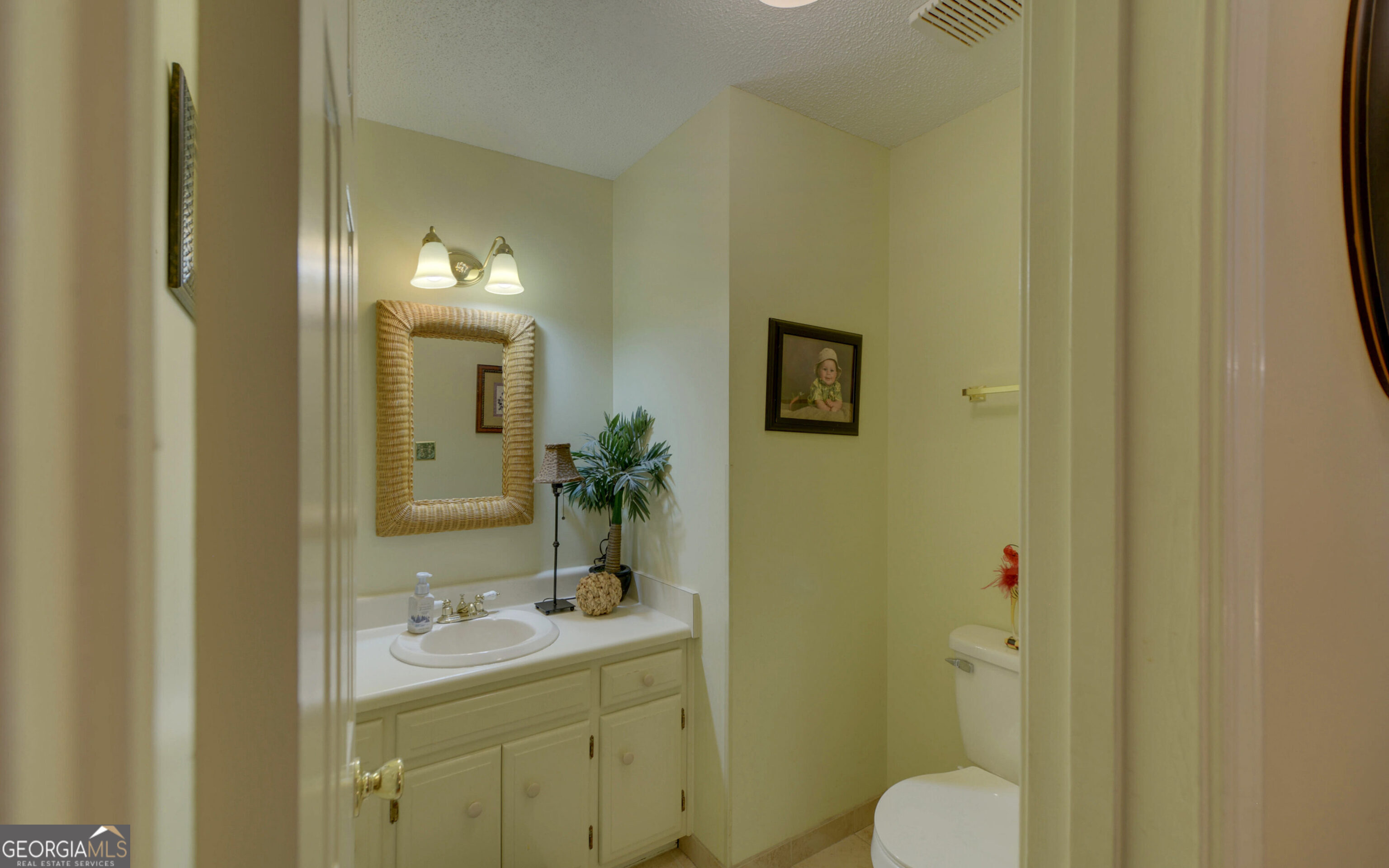 43 Pauline Avenue Toccoa, GA 30577 - Photo 17 of 40 a bathroom with a toilet a sink and mirror