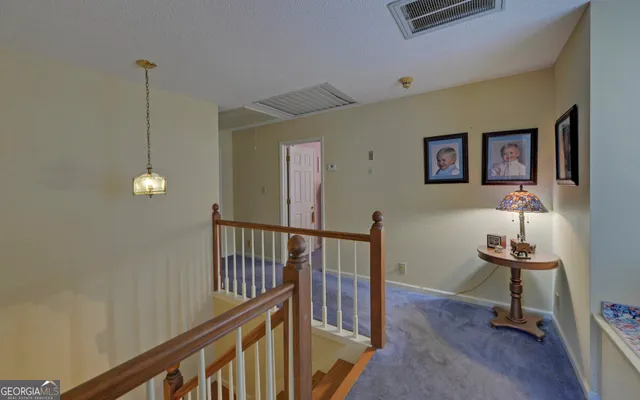 a view of a hallway with workspace