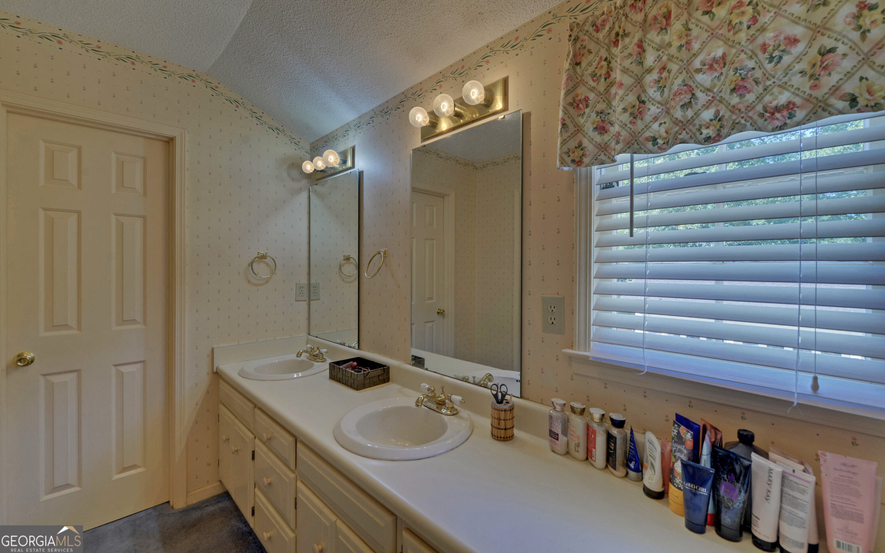 43 Pauline Avenue Toccoa, GA 30577 - Photo 24 of 40 a bathroom with a sink and a mirror