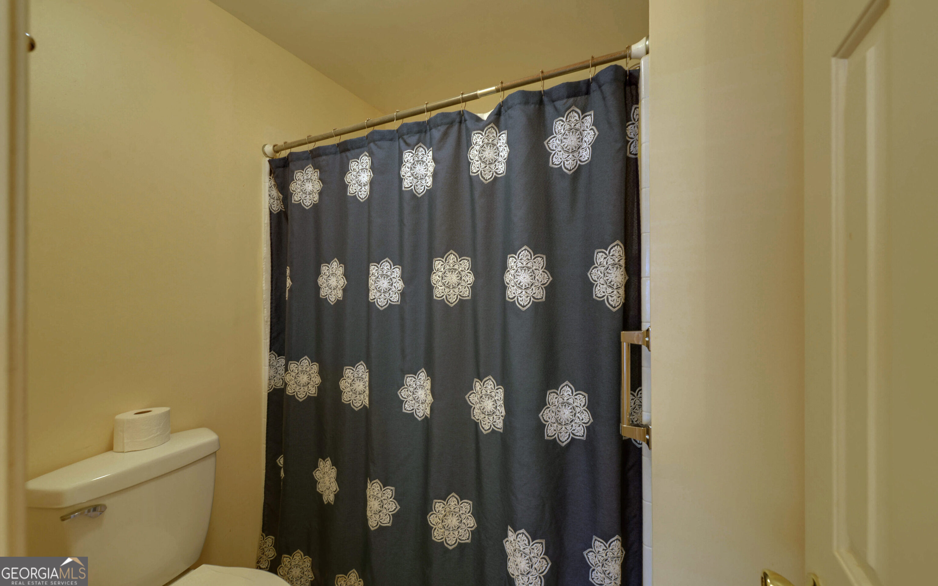 43 Pauline Avenue Toccoa, GA 30577 - Photo 26 of 40 a bathroom with a toilet and a shower