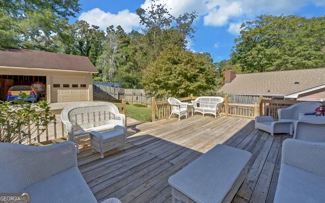 a view of a wooden deck with a patio