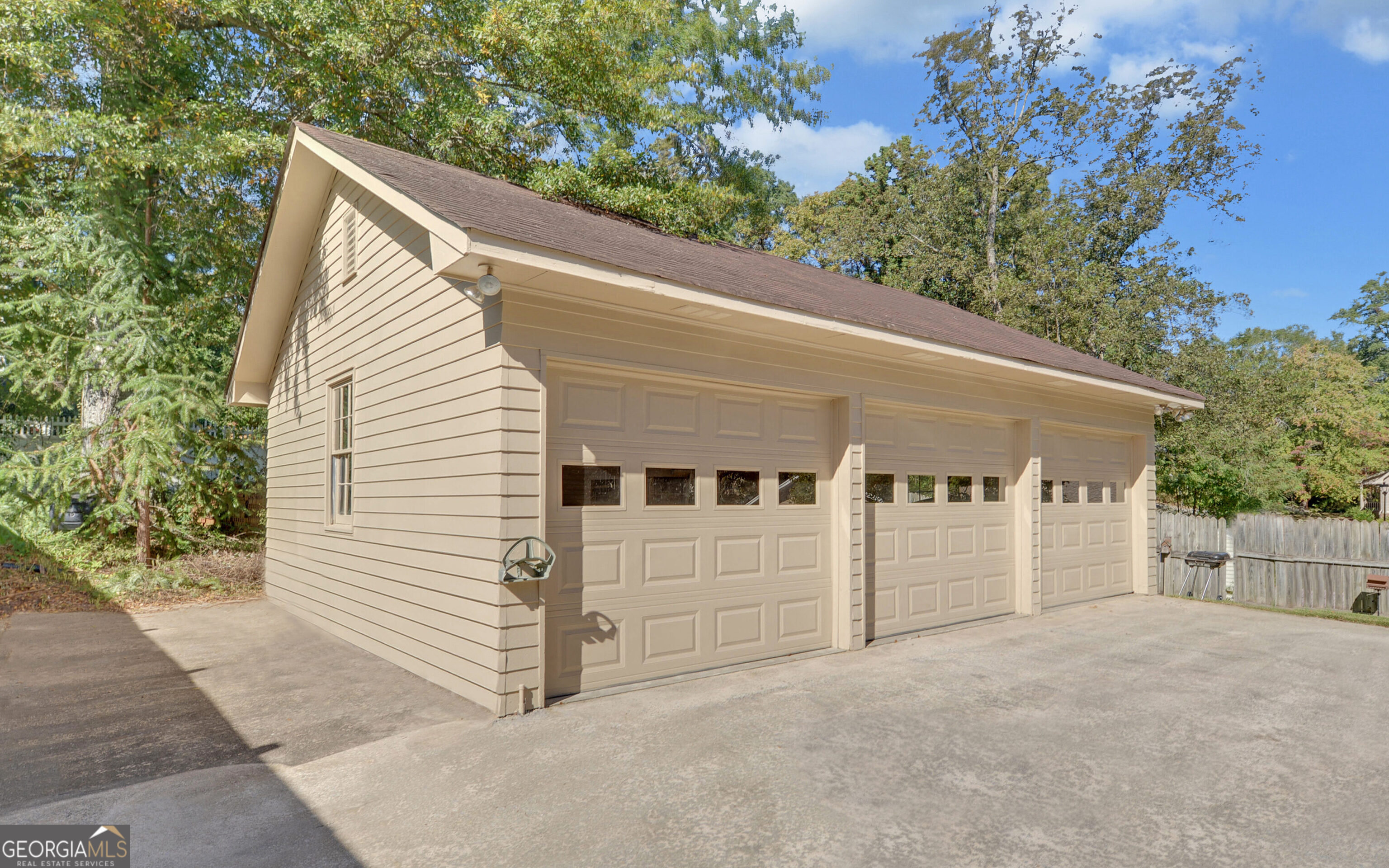 43 Pauline Avenue Toccoa, GA 30577 - Photo 37 of 40 a view of a white house with a yard and garage