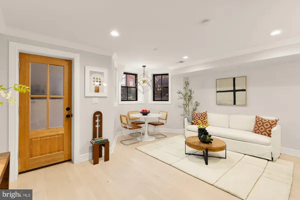 a living room with furniture and a table