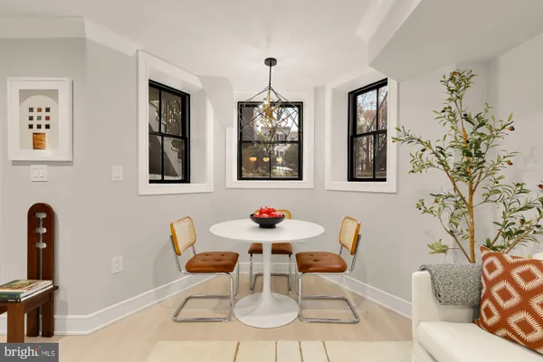 a dining room with furniture and window