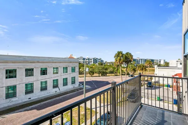 a view of a street from a balcony