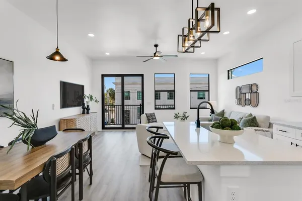 a view of a livingroom with furniture and a flat screen tv