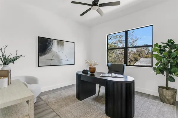 a view of a workspace with furniture